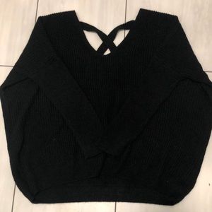 black 3/4 length sleeve shirt, cross at the back